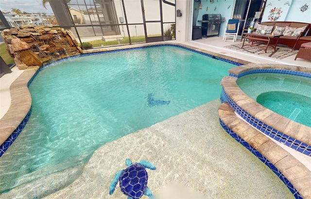 view of pool featuring a patio area, a lanai, an in ground hot tub, and grilling area