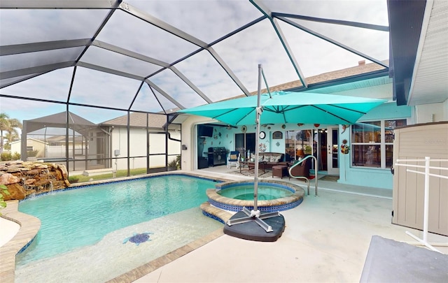 view of pool with an in ground hot tub, glass enclosure, and a patio area