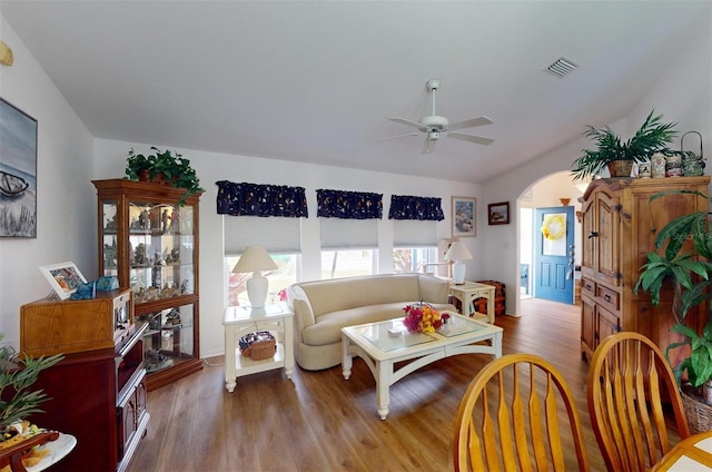 living room featuring ceiling fan and light hardwood / wood-style floors