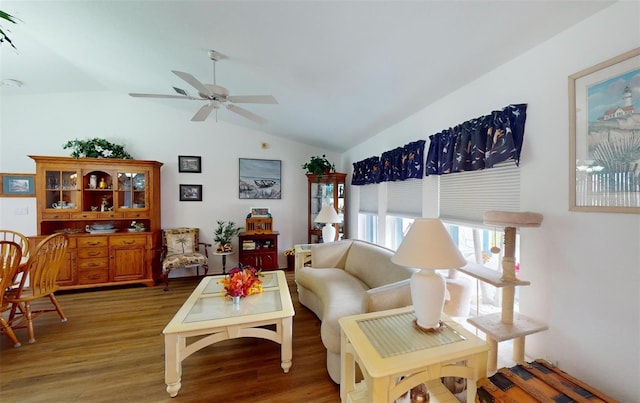 living room featuring hardwood / wood-style floors, ceiling fan, and lofted ceiling