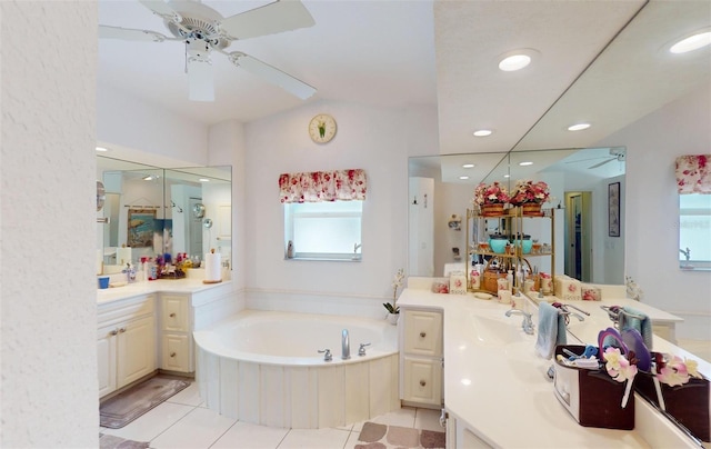 bathroom featuring tile patterned flooring, vanity, and a wealth of natural light