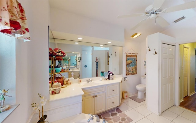 bathroom featuring tile patterned flooring, vanity, toilet, and ceiling fan