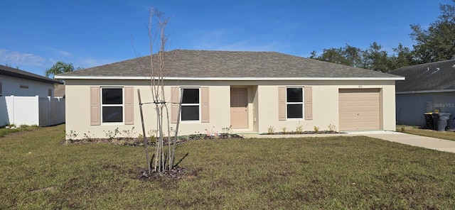 view of front of home with a garage and a front yard