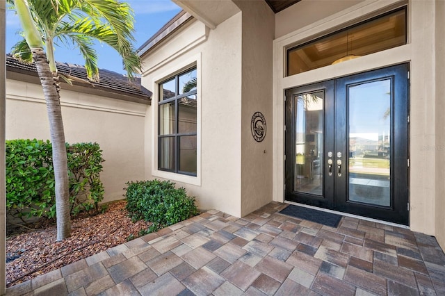 entrance to property featuring french doors