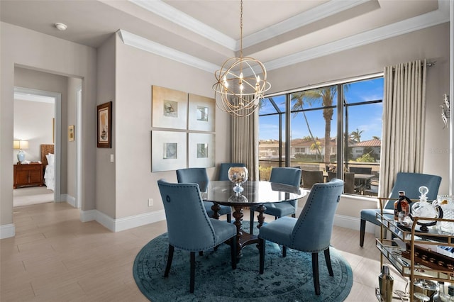 dining room featuring ornamental molding and an inviting chandelier