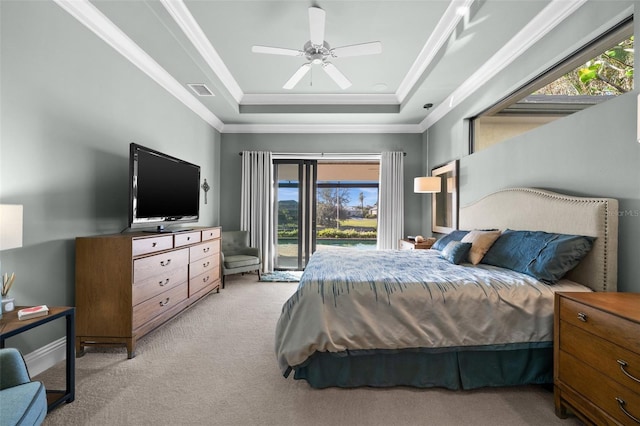 bedroom with multiple windows, ceiling fan, light colored carpet, and access to exterior