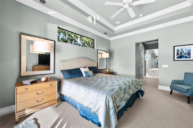 bedroom with connected bathroom, ceiling fan, a raised ceiling, crown molding, and light colored carpet