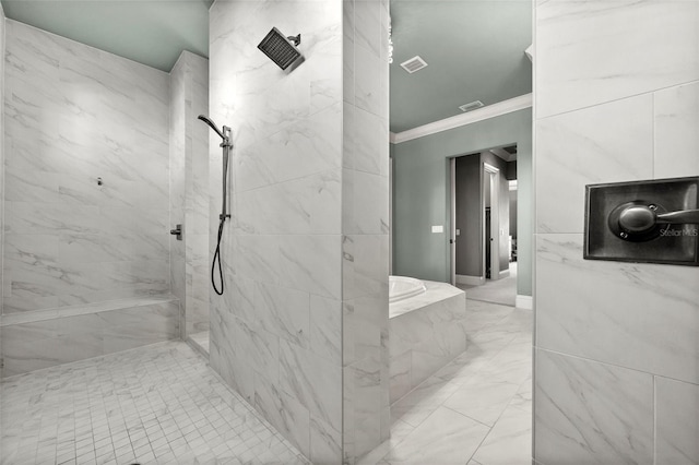 bathroom featuring tiled shower and ornamental molding