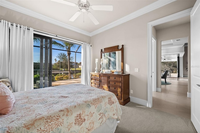 carpeted bedroom featuring access to outside, multiple windows, ceiling fan, and ornamental molding