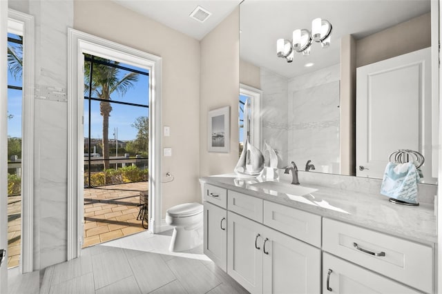 bathroom with vanity and toilet