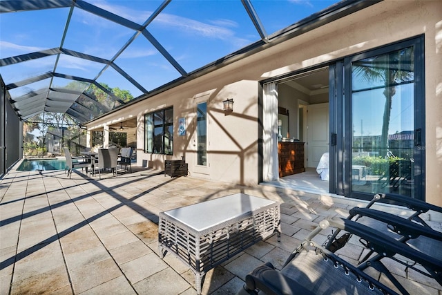 view of patio / terrace featuring a lanai