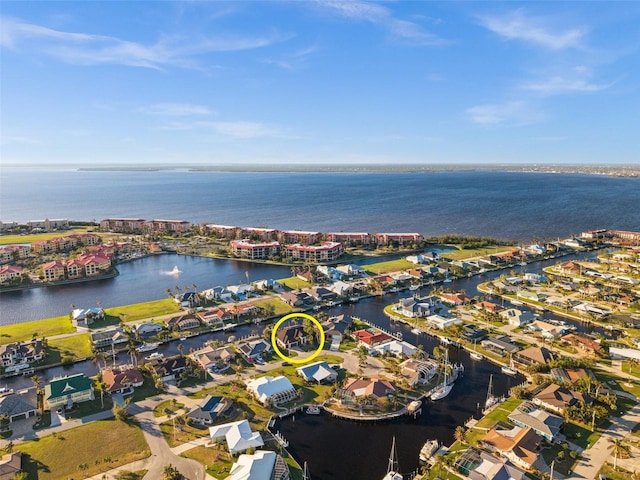 birds eye view of property featuring a water view