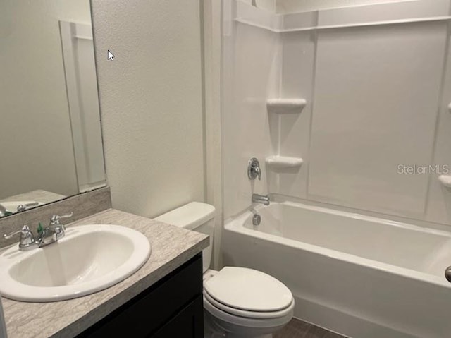 full bathroom with vanity, toilet, and shower / tub combination