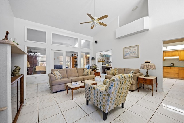 living room featuring light tile patterned floors, high vaulted ceiling, and ceiling fan