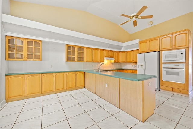 kitchen with white appliances, vaulted ceiling, ceiling fan, sink, and light tile patterned floors