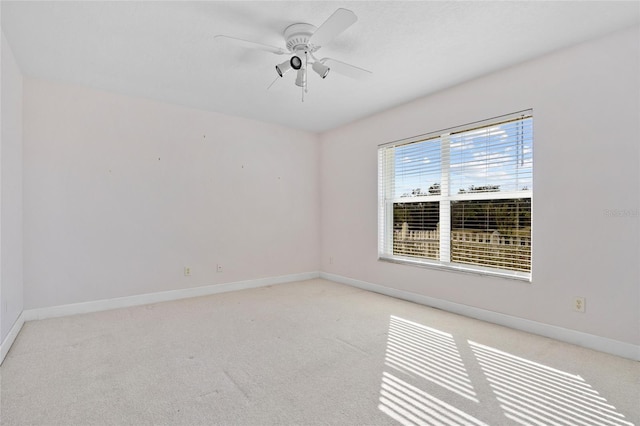 empty room with light carpet and ceiling fan