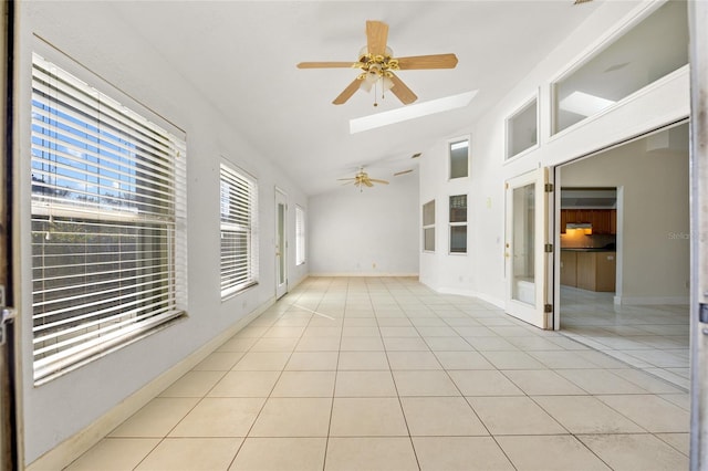 interior space featuring vaulted ceiling with skylight