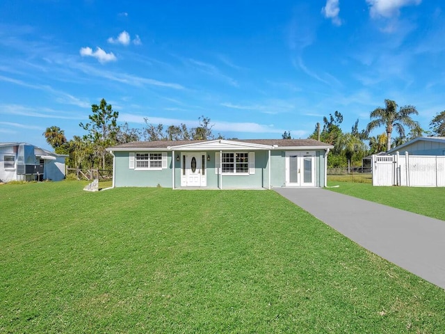 single story home with french doors, a porch, and a front yard