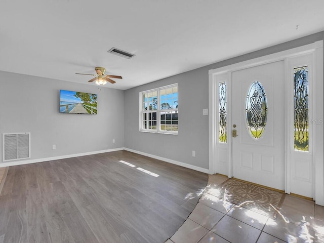 entryway with hardwood / wood-style flooring and ceiling fan