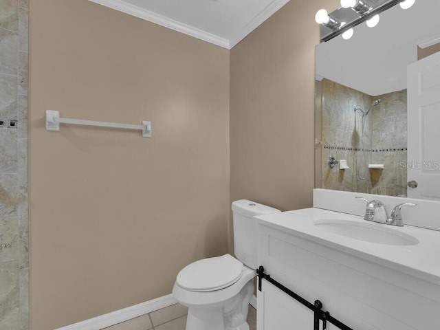 bathroom with tile patterned floors, vanity, crown molding, tiled shower, and toilet