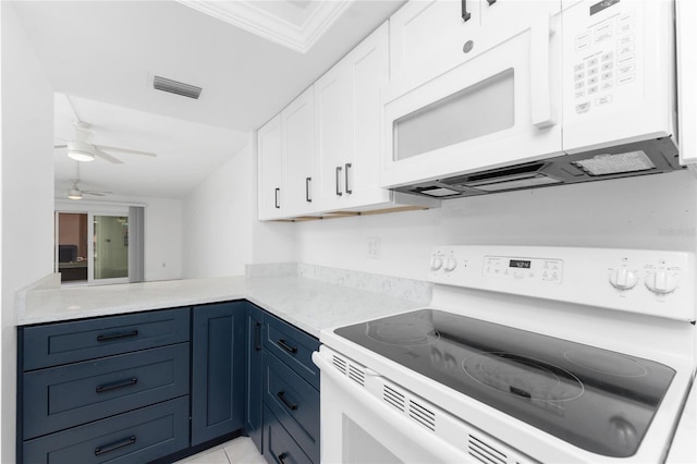 kitchen featuring white appliances, blue cabinetry, ceiling fan, white cabinets, and kitchen peninsula