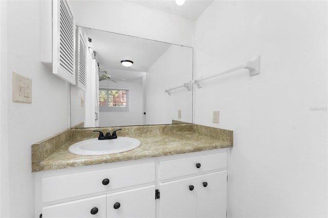 bathroom with ceiling fan and vanity