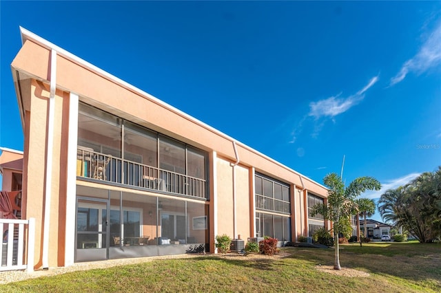 view of building exterior featuring central air condition unit