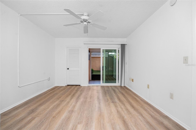 spare room with ceiling fan, a textured ceiling, and light hardwood / wood-style floors