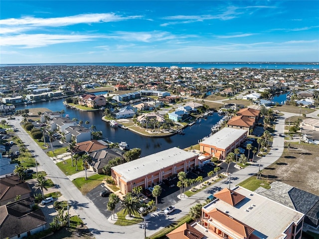 drone / aerial view with a water view