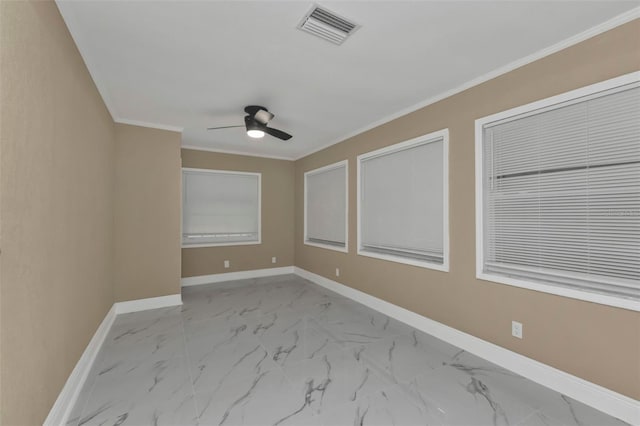 empty room with ceiling fan and ornamental molding