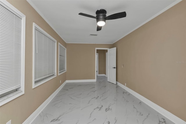 interior space featuring ceiling fan and ornamental molding