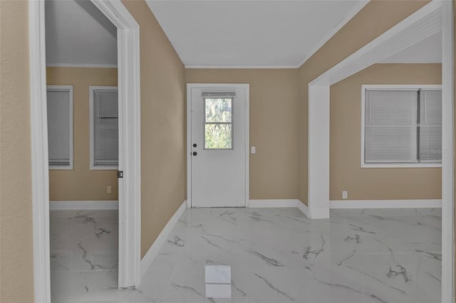 foyer featuring ornamental molding