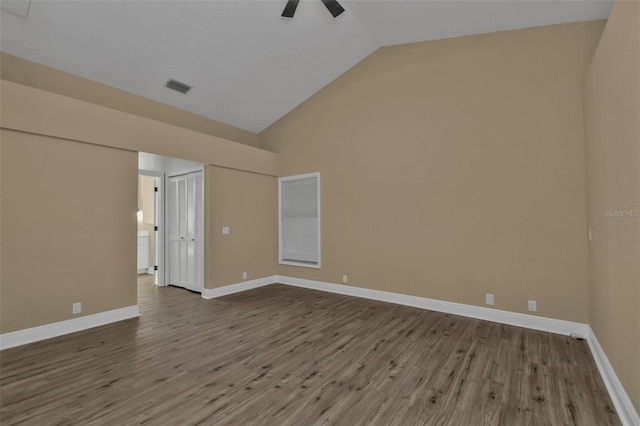 unfurnished room featuring ceiling fan, hardwood / wood-style floors, and lofted ceiling