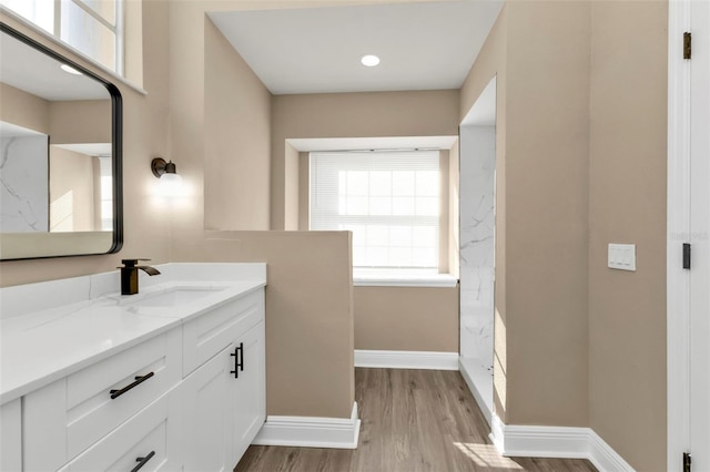 bathroom featuring hardwood / wood-style flooring and vanity