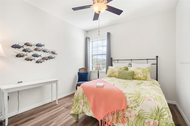 bedroom with ceiling fan and wood-type flooring