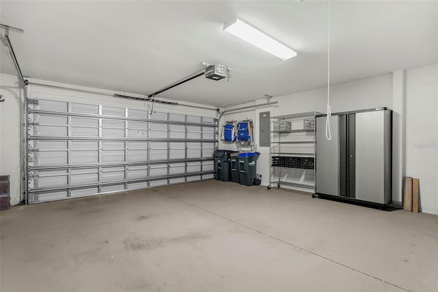 garage with electric panel and a garage door opener