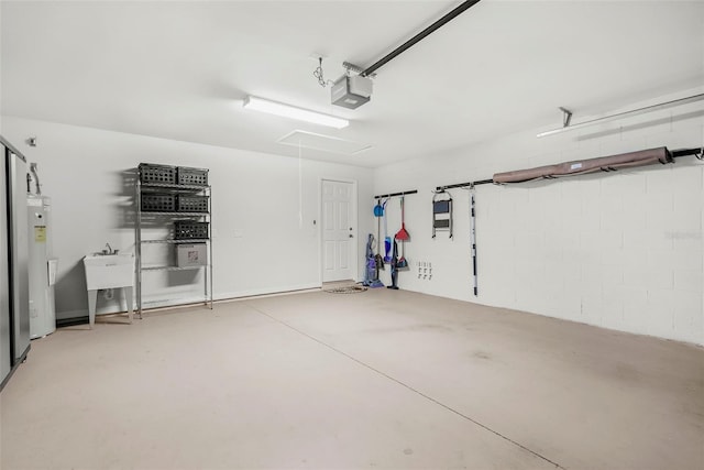 garage with sink, a garage door opener, and water heater