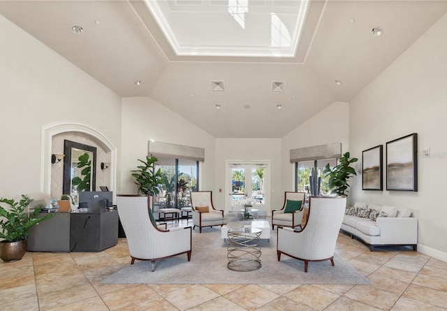 living room featuring light tile patterned floors, baseboards, visible vents, high vaulted ceiling, and french doors