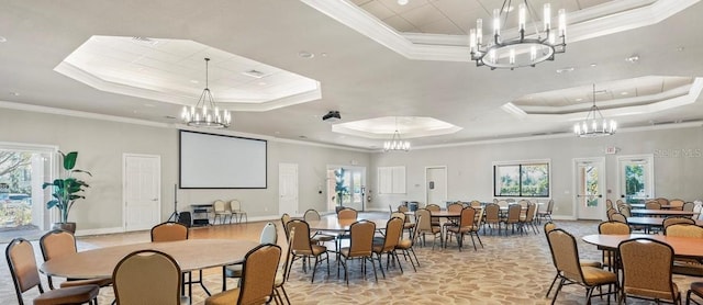 dining room featuring a raised ceiling, a notable chandelier, and ornamental molding