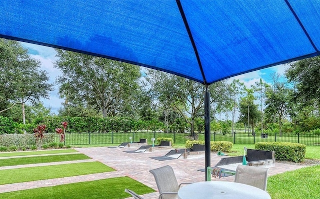 view of patio featuring fence