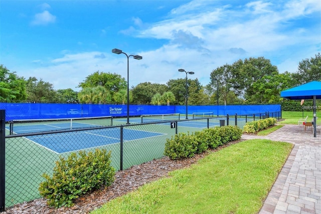 view of sport court with fence