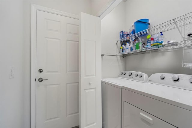 laundry area with laundry area and washing machine and clothes dryer