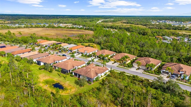 aerial view with a residential view and a wooded view