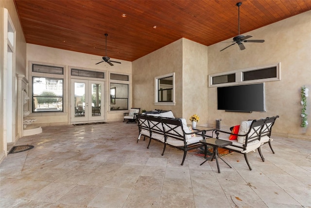 view of patio / terrace featuring french doors, an outdoor living space, and ceiling fan