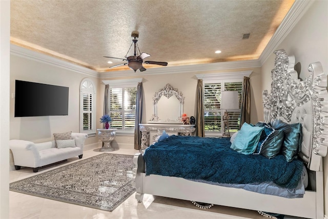 bedroom featuring ceiling fan, ornamental molding, and a textured ceiling