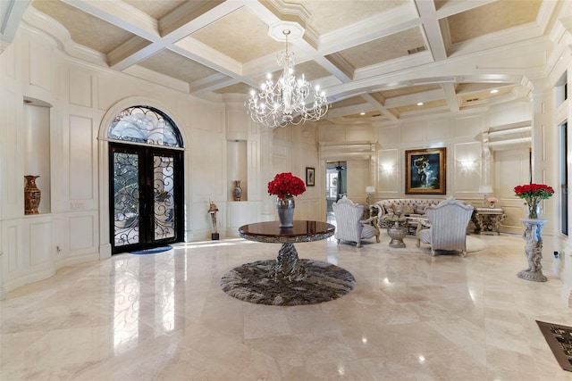 foyer entrance with french doors, coffered ceiling, crown molding, beamed ceiling, and plenty of natural light