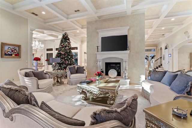 living room featuring beamed ceiling, coffered ceiling, and a notable chandelier