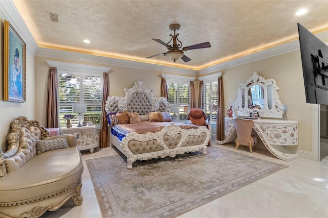 bedroom with ceiling fan, a textured ceiling, and ornamental molding