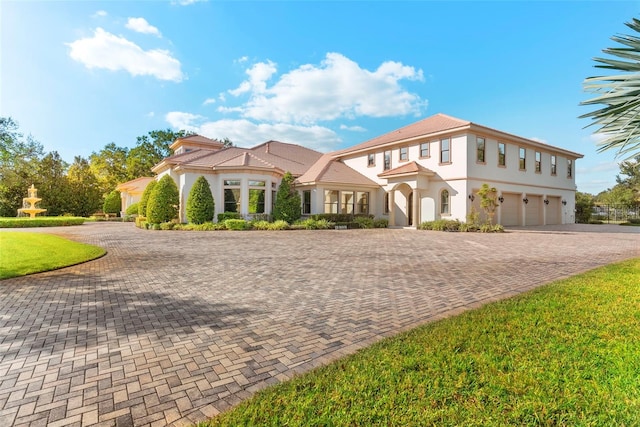 mediterranean / spanish-style house featuring a garage