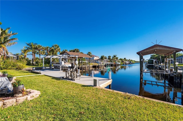 view of dock featuring a yard and a water view